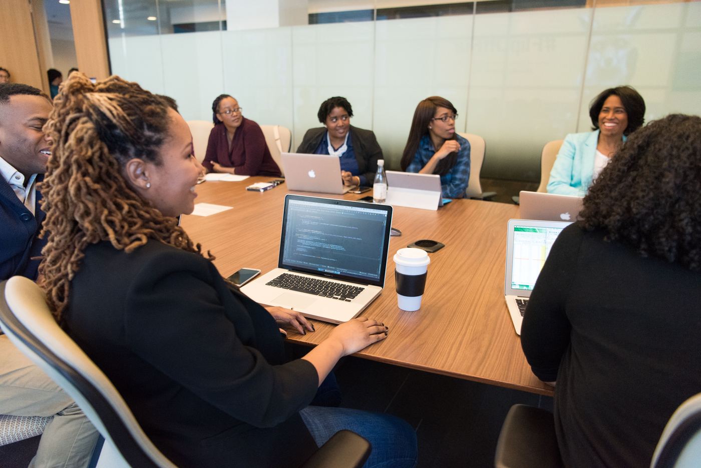 The Acculine Systems team collaborating around a conference table